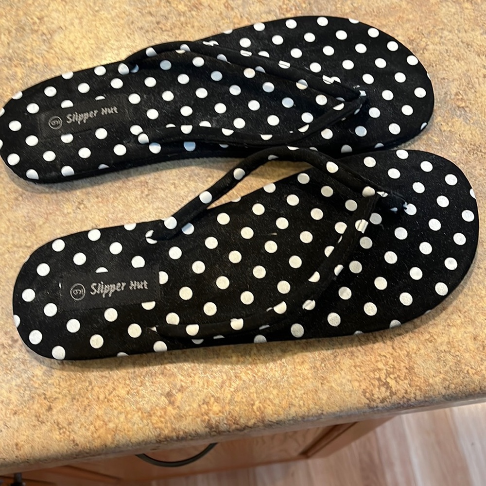 Black white polka dot flip flops. Good condition